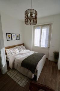 A bed or beds in a room at Valtellina Vacanze