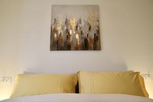 A bed or beds in a room at Valtellina Vacanze