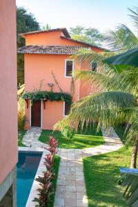 a house with a swimming pool in front of it at Casa de Miguel in São Miguel do Gostoso