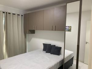 Katil atau katil-katil dalam bilik di Muro Alto Condomínio Clube - Flat +26 gambar