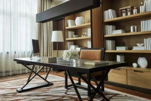 a black desk in a room with a book shelf at Four Seasons Hotel Mexico City in Mexico City
