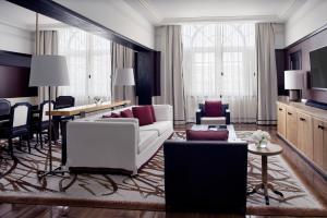 a living room with a white couch and a table at Four Seasons Hotel Mexico City in Mexico City