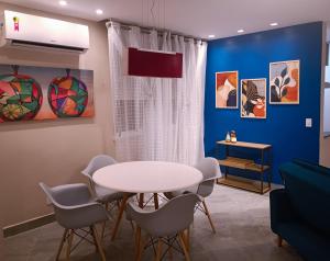 a dining room with a white table and chairs at PIRAGIBE FROTA AGUIAR in Rio de Janeiro +11 photos