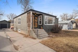 a small house with the door open on a street at Walk to Parks Pet Friendly Top Neighborhood in Rapid City