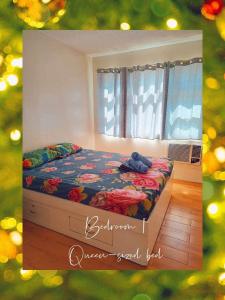a bedroom with a bed with a teddy bear on it at Seawind Condominium 2BR unit in Davao City +22 photos