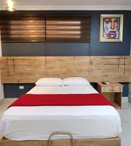 Voodi või voodid majutusasutuse Hotel Murali - Cerca del Aeropuerto de Guayaquil toas