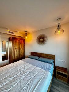 A bed or beds in a room at La Marina de Aiguadolç