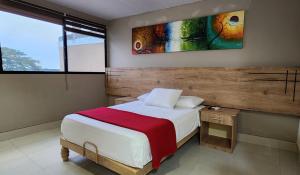 Voodi või voodid majutusasutuse Hotel Murali - Cerca del Aeropuerto de Guayaquil toas