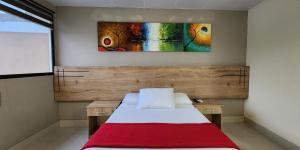 Voodi või voodid majutusasutuse Hotel Murali - Cerca del Aeropuerto de Guayaquil toas