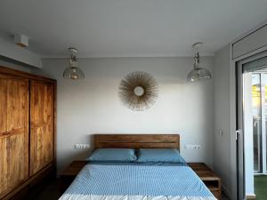 A bed or beds in a room at La Marina de Aiguadolç