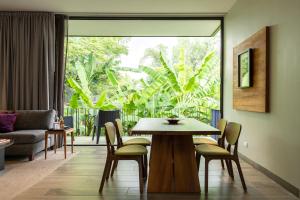 a dining room with a table and chairs at El Callejón Hotel Boutique in Oaxaca City
