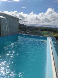 Bazén v ubytovaní Casa de temporada em Jacaraípe alebo v jeho blízkosti