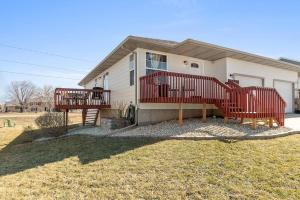 a house with two decks in front of it at Pet Friendly 2 King Beds Foosball Table in Rapid City