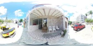 a rendering of a building with chairs on a street at Pousada Porto Seguro in Porto De Galinhas