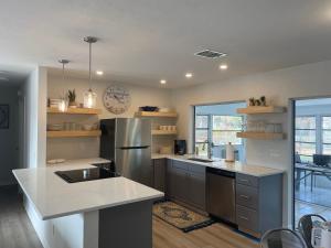 a kitchen with a sink and a counter top at The Flip Flop - UPDATED vacation home! in Naples