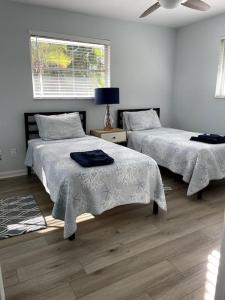 a bedroom with two beds and a window at The Flip Flop - UPDATED vacation home! in Naples