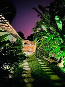 a garden with a pathway with plants and a building at Villa de Bemposta-Trancoso in Trancoso