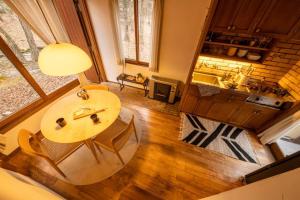 an overhead view of a living room with a table and chairs at Tatehata House. Private Sauna. Outdoor Bath. in Kita-karuizawa +57 photos