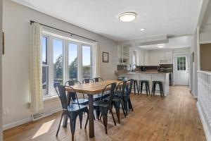 a kitchen and dining room with a table and chairs at Roomy 5 Bed 3 Bath Fire Place Large Outdoor Space in Rapid City