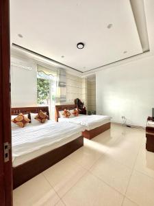 Rúm í herbergi á Hoàng Anh hotel