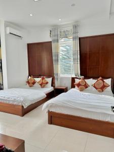 Rúm í herbergi á Hoàng Anh hotel