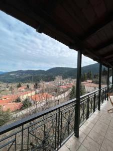 a balcony with a view of a town at Ελατόδασος in Pávliani