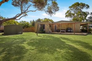 a house with a large yard at Philippas Paddock in Cowes