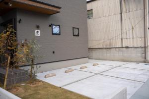 a patio with a window on the side of a building at Second Home 瀬戸風月 in Takamatsu