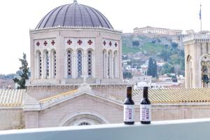 two bottles of wine sitting on top of a building at AboV Athens in Athens