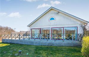 a house with large windows on the side of it at Pet Friendly Home In Laholm With Wifi in Laholm