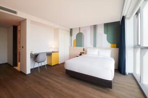 ibis Styles Ambassador Incheon Airport T2客房内的一张或多张床位