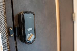 a black door with an iphone on it at Second Home 瀬戸風月 in Takamatsu