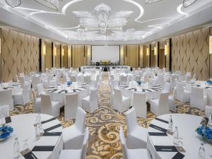 a banquet hall with white tables and white chairs at InterContinental Phuket Resort by IHG in Kamala Beach +270 photos