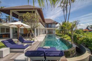 Πισίνα στο ή κοντά στο Beachfront Luxury, Villa Purnama