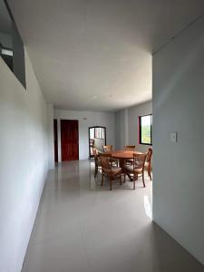 a dining room with a table and chairs at RedDoorz at FJ Hotel Tubungan Iloilo 