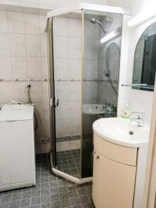 Koupelna v ubytování Taiga city center aparments