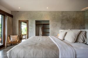 Hidden Gem Suites Ubud客房内的一张或多张床位