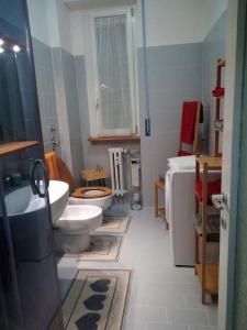 a bathroom with two toilets and a sink at C&C - Cozy and Cute in Milan