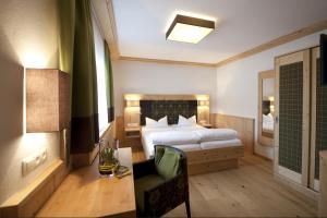 Postel nebo postele na pokoji v ubytování Hotel Bierwirt