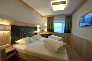 Postel nebo postele na pokoji v ubytování Hotel Bierwirt