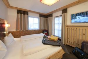 Postel nebo postele na pokoji v ubytování Hotel Bierwirt