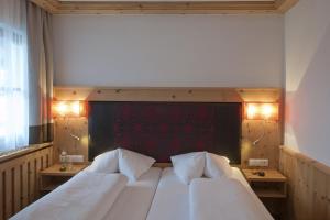 Postel nebo postele na pokoji v ubytování Hotel Bierwirt