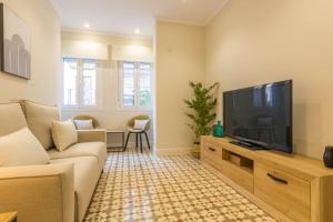 Televízia a/alebo spoločenská miestnosť v ubytovaní Apartamento Anita's Place Cordoba