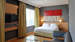 En eller flere senger på et rom på Hotel KIMAYA Slipi Jakarta By HARRIS