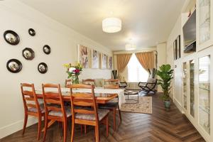 a dining room with a table and chairs at The Eagles in Ramsgate