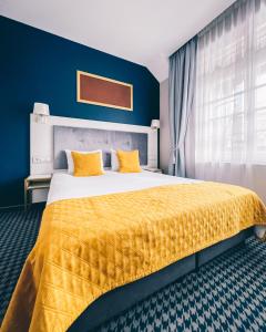 Łóżko lub łóżka w pokoju w obiekcie Hotel Villa Art Novis City Center
