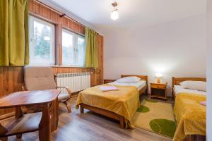 Posteľ alebo postele v izbe v ubytovaní Domek Koliba