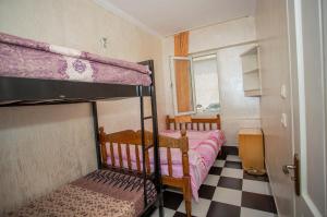 Postel nebo postele na pokoji v ubytování Hostel California