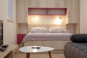 Posteľ alebo postele v izbe v ubytovaní Apartmani Vito i Cvita