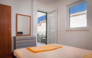 Posteľ alebo postele v izbe v ubytovaní Apartmani Vito i Cvita